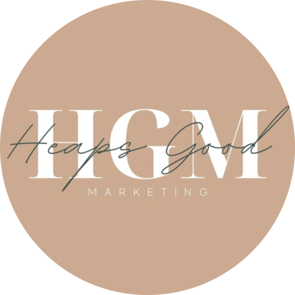 Logo of Heaps Good Marketing (HGM) with white text on a beige circular background. "Heaps Good" is cursive, overlaying "HGM" in capital letters, with "MARKETING" in smaller letters below, representing a social media scheduler | plannthat.com Logo of Heaps Good Marketing (HGM) with white text on a beige circular background. "Heaps Good" is cursive, overlaying "HGM" in capital letters, with "MARKETING" in smaller letters below, representing a social media scheduler | plannthat.com